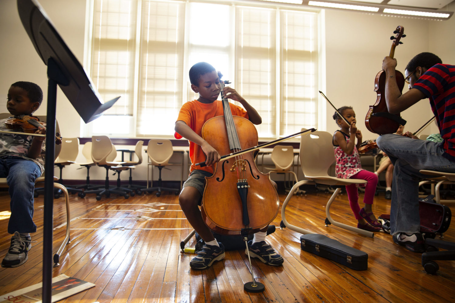 Young student plays the cello.