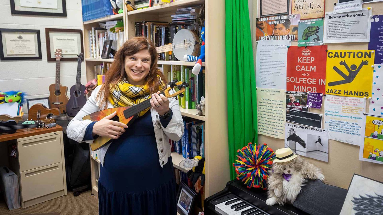  Assistant Professor of music education Robin Giebelhausen plays her favorite ukulele as she shows off fun puppets, stuffed animals, musical instruments and memes throughout her office in The Clarice Smith Performing Arts Center.