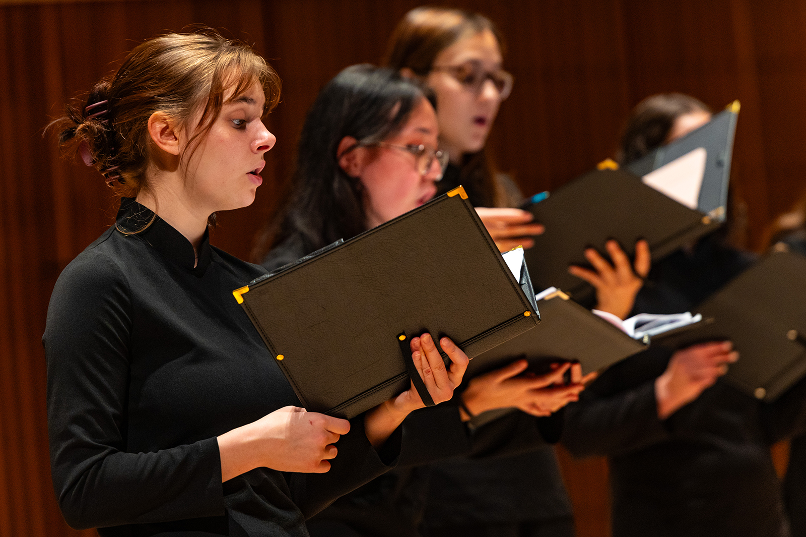 Choral students sing during a concert.