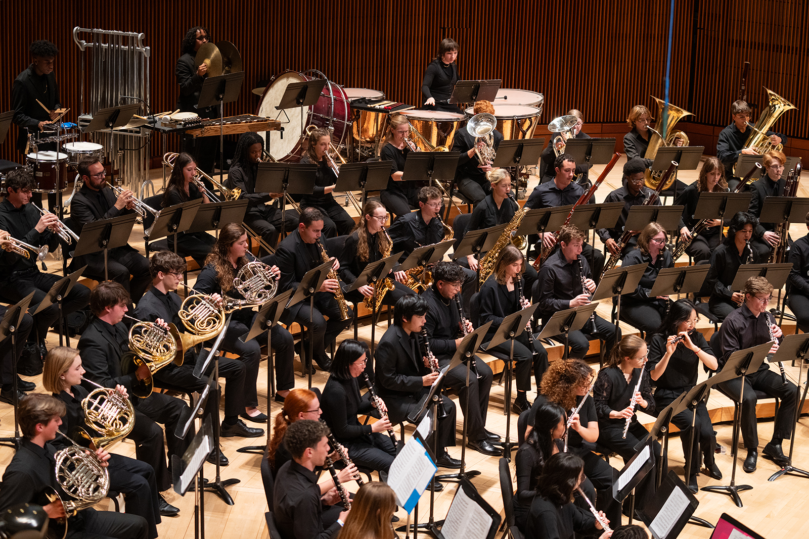 The UMD Wind Ensemble perform on stage.