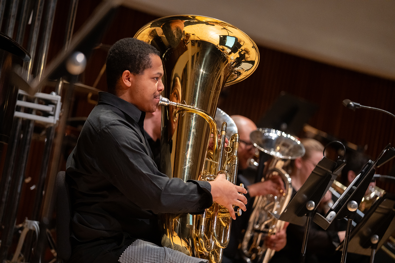 A student plays the tuba during a concert at The Clarice.