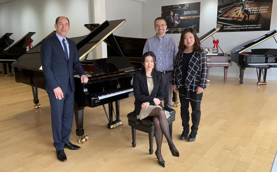  Matthew Bachman and faculty from a local school select a Steinway D concert grand.