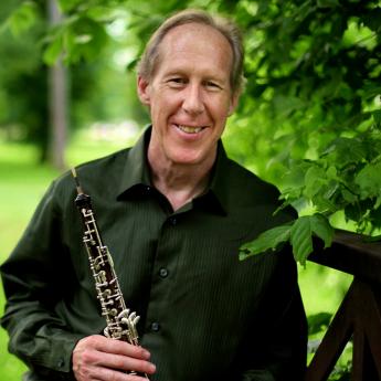  Mark Hill holding his oboe.